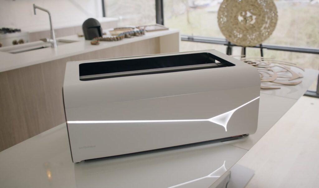 LX30 3-in-1 3D printer, laser engraving, & cnc carving machine on table in workspace